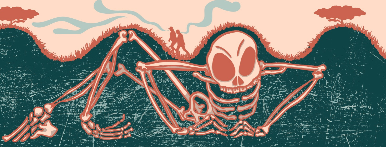 a skeleton lurks under a hill while a couple hikes above and smells it
