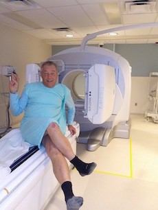 Cliff poses in front of an MRI machine