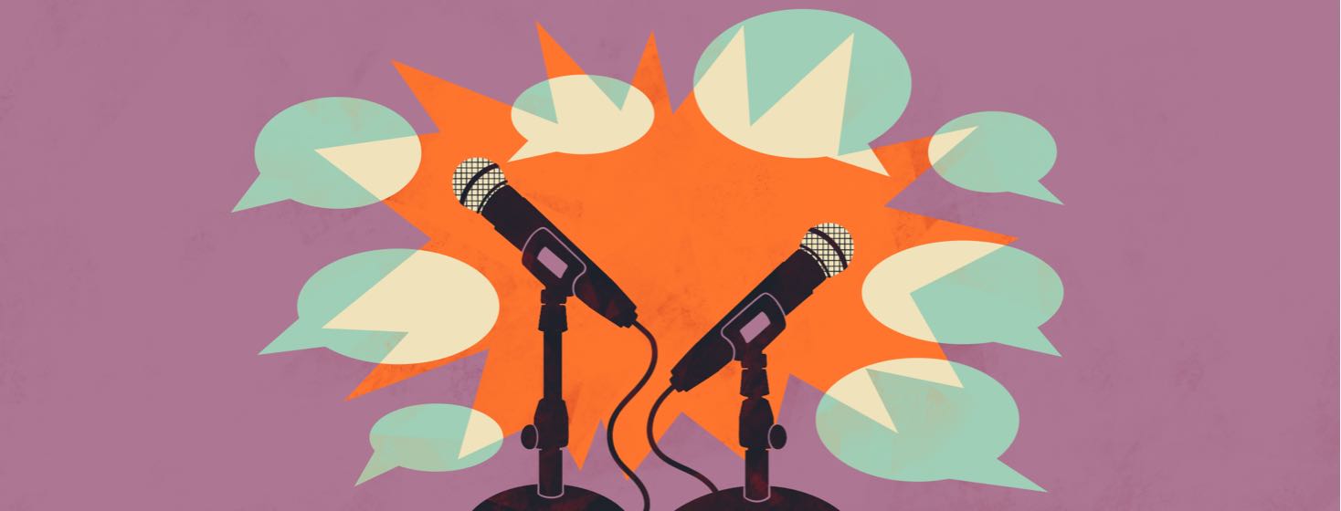 Microphones surrounded by speech bubbles.